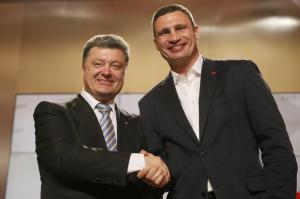 Ukrainian-businessman-politician-and-presidential-candidate-Poroshenko-gestures-as-heavyweight-boxing-champion-and-UDAR-party-leader-Klitschko-l